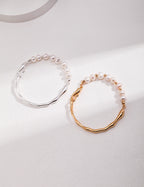 Vintage-gold sterling silver bracelet with natural pearls, small metal beads and an irregular fluid band.