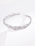 Sterling silver chain bracelet with spaced cubic zirconia accents and an airy adjustable design.