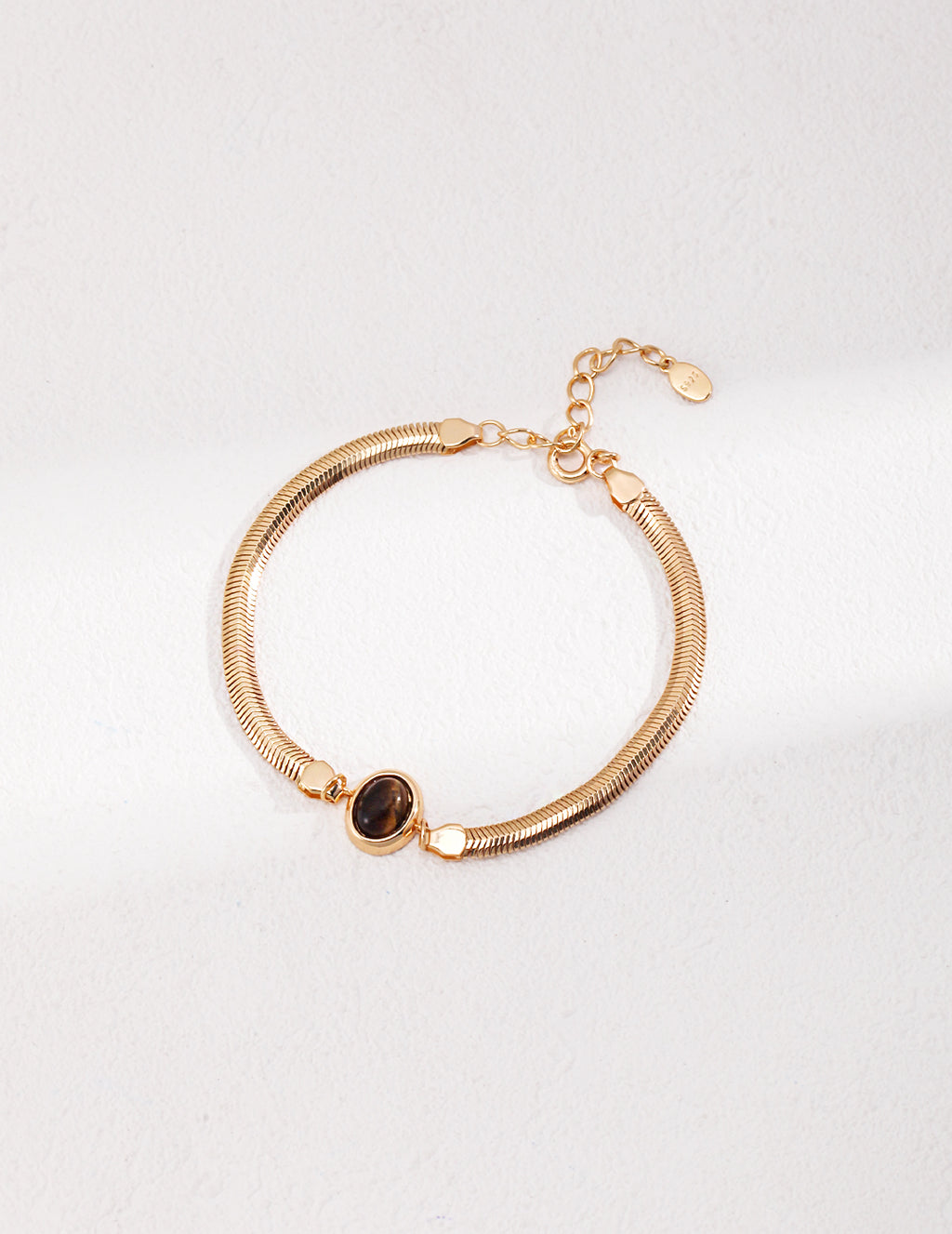 Vintage-gold double-strand sterling silver bracelet with a central oval tiger's eye stone.