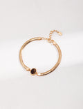 Vintage-gold double-strand sterling silver bracelet with a central oval tiger's eye stone.
