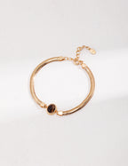 Vintage-gold double-strand sterling silver bracelet with a central oval tiger's eye stone.