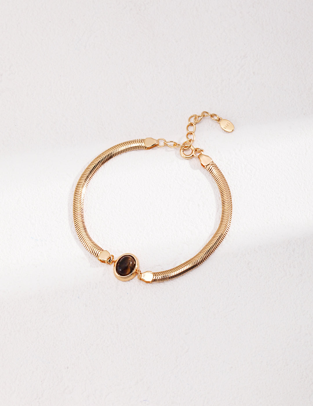 Vintage-gold double-strand sterling silver bracelet with a central oval tiger's eye stone.