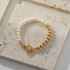 Vintage-gold sterling silver bracelet with natural pearls arranged in a restrained beaded composition.
