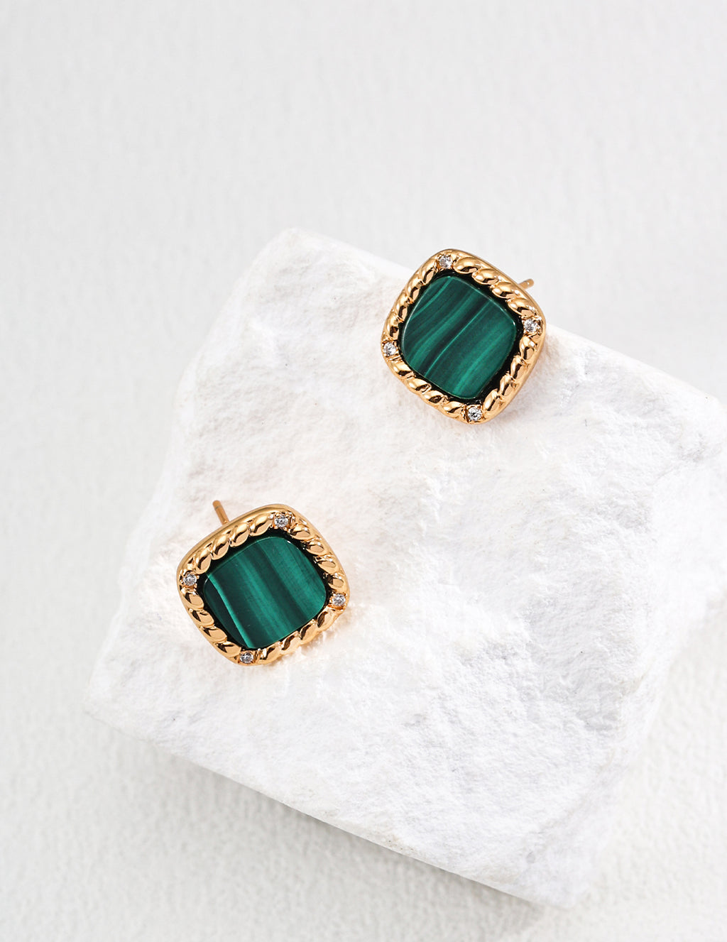 Vintage-gold sterling silver stud earrings with rounded-square green malachite centers, textured borders and small clear zircon accents.