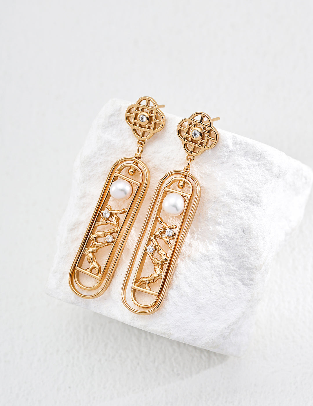 Vintage-gold sterling silver drop earrings with open lattice forms, branching details, zircon accents and suspended natural pearls.