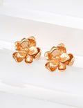 Vintage-gold sterling silver floral stud earrings with two layers of irregular textured petals and a small metal center.