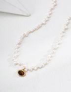 Vintage-gold sterling silver necklace with natural pearls and Tiger's Eye details.