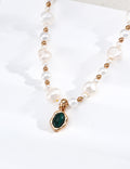 Vintage-gold sterling silver necklace with irregular white pearls, polished beads and an oval green malachite pendant in an undulating metal surround.